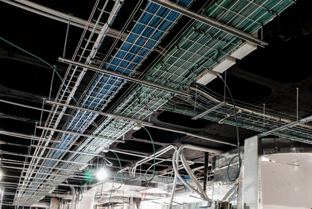 Cable trays carrying electrical and data cabling