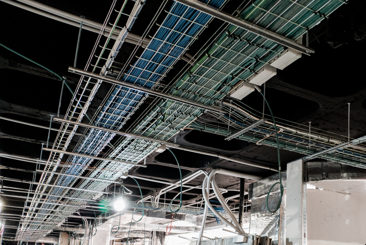Cable trays carrying electrical and data cabling